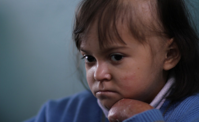 Maria Alejandra looks on in class